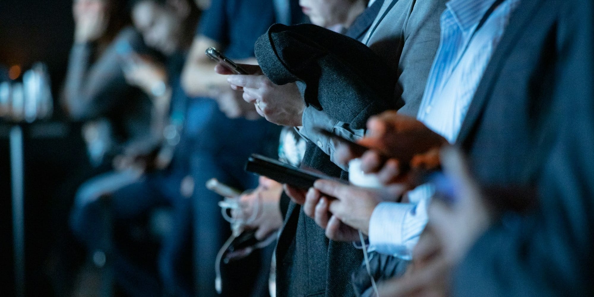 people using phone while standing